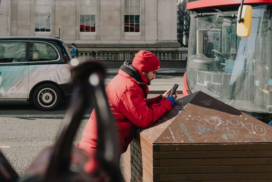 Local business owner using a phone outdoors